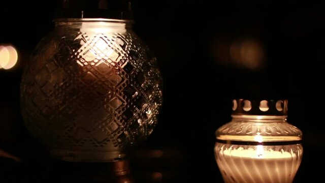 Close-Up Of Candles Burning At A Cemetery During All Saints Day.