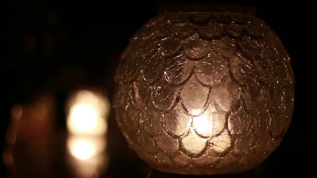 Close-Up Of Candles Are Lit At A Cemetery During All Saints Day.