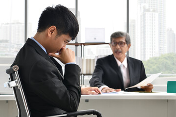 Angry boss yelling at employee, business concept, Asian businessman