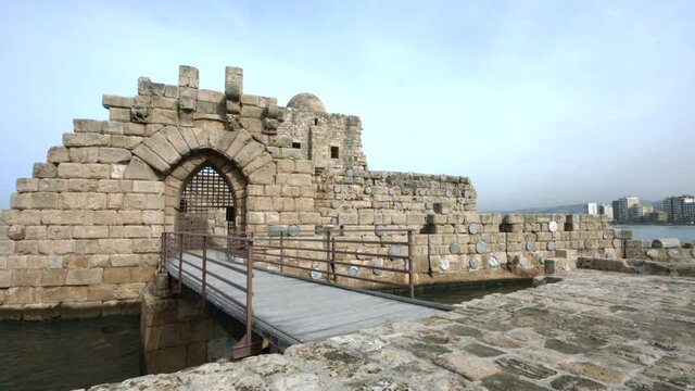 Pan left to the entrance of Sidon Sea Castle in Sidon, Lebanon