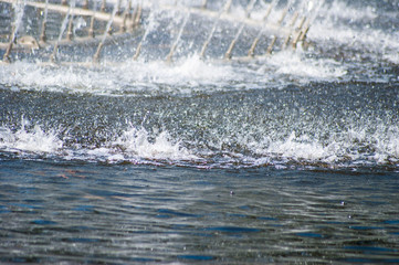 Water sprays and splashes in the park fountain