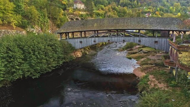4k Aerial view of wood bridge over Murg river, Forbach, Germany