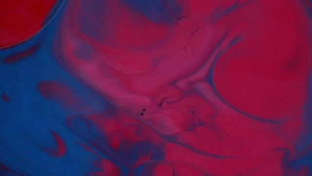 Abstract liquid ink painting texture. Blue and red color swirl marble background. Psychedelic.