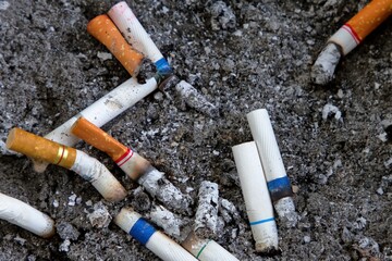 Cigarette stub in the ashtray.