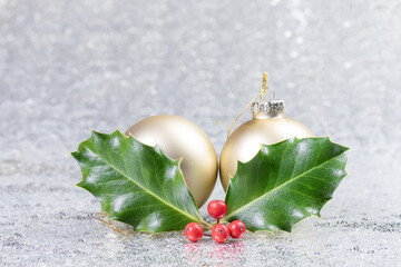 Christmas card with christmas balls and holly leaves