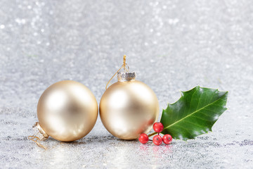 Christmas card with christmas balls and holly leaves