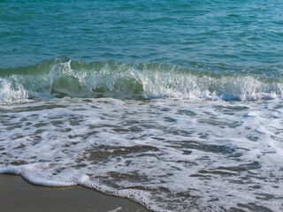 Detailed view of powerful Mediterranean Sea wave with surf and foam