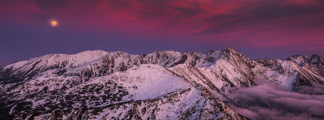 Sunset in Kopa Kondracka in Polish Tatra Mountains in winter snow weather conditions