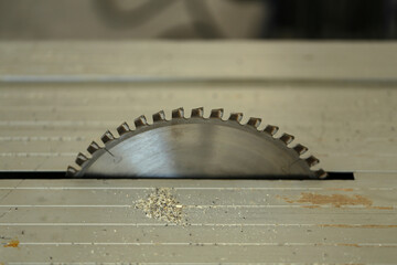 Closeup of circular saw on bench of woodworking