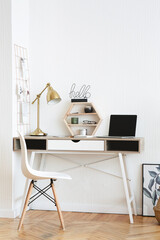 Stylish and modern working desk at home in scandinavian style