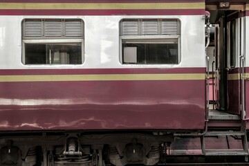 Side view of old vintage bogie and doorway of diesel electric locomotive train on railroad track, Take picture from platform.