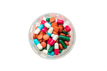 Pills and capsules in a glass. Cocktail of medicines. Monitoring of treatment.  antiviral medicine