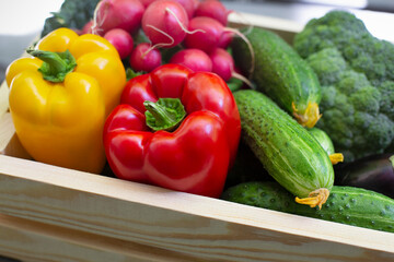 Close up of fresh organic vegetables in wooden box