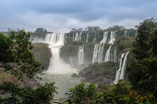 The main attraction of Brazil and Argentina is the famous Iguazu Falls among the lush green jungle. Huge streams of water fall to the ground. UNESCO World Heritage. Picture from paradise. © Tanya Hendel