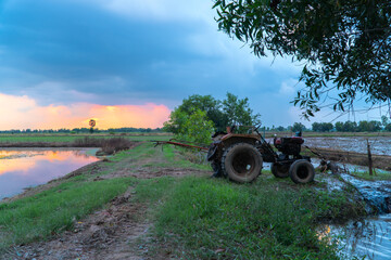 Farmers use tractors to pump water all day until the sun goes down..