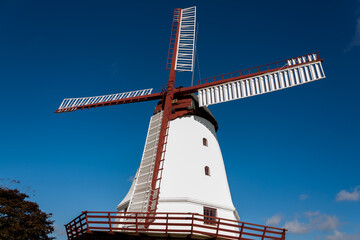 old windmill on background of blue sky © Jan