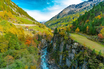 View of the Venter Ache valley near Winterstall with beautiful coloured trees on a bright autumn day