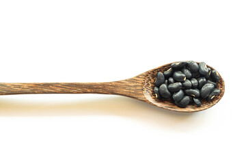 black bean in wooden spoon