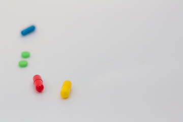 Medicines on neutral background. Concept of legal drug abuse. Medications in the form of pills or capsules.