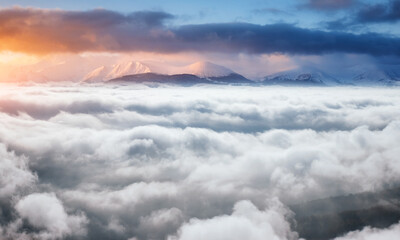Naklejka na ściany i meble Perfect morning moment in alpine foggy valley.