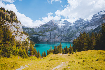 Idyllic panorama view of the azure lake Oeschinensee. Location place Swiss alps, Kandersteg,...