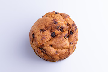 Christmas chocolate cake panettone on white background, soft light, top view, also know as chocotone panetone