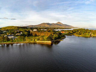 Aerial view of Croagh Patrick mountain and Westport bay at sunrise
