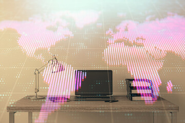 Map hologram and desktop office computer background. Multi exposure. Concept of international business