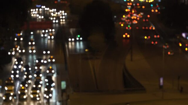 Intentionally defocused night lights traffic during rush hour near Atocha railway station in Madrid, as an example for traffic city pollution. Spain has offered to host COP25 or United Nations Climate
