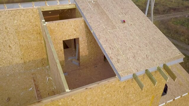 Construction of new and modern modular house. Walls made from composite wooden sip panels with styrofoam insulation inside. Building new frame of energy efficient home concept.