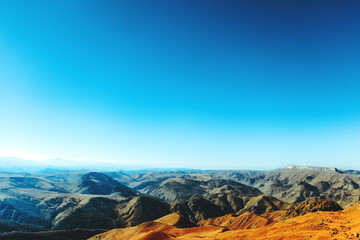 Caucasian ridge. Mountain blue landscape. Yellow valley Sunny day