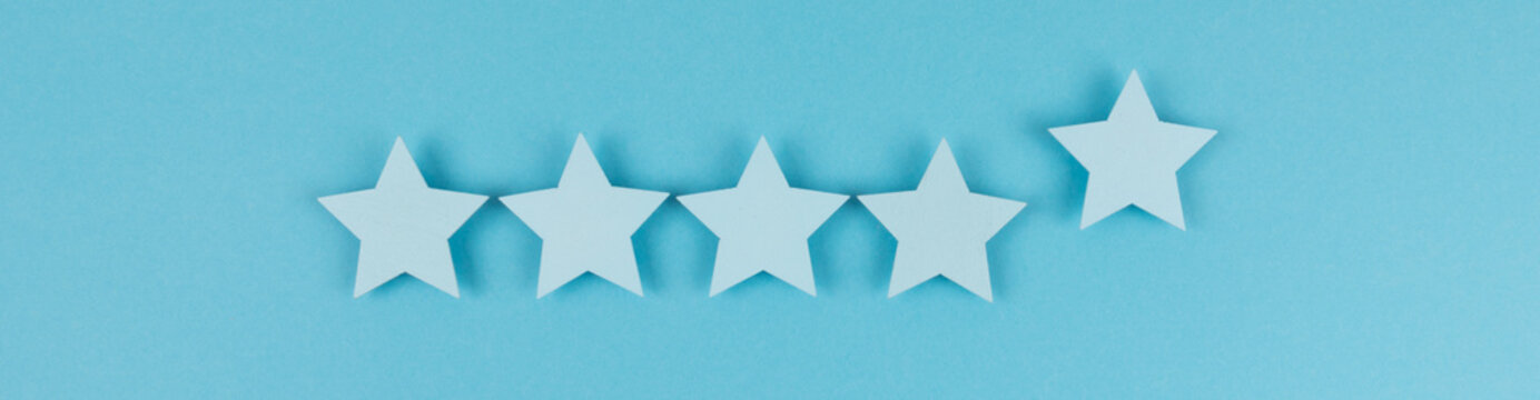 Customer satisfaction survey, services rating concepts. five star symbol on blue background, copy space