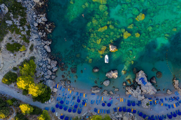 Anthony Quinn Bay. The most beautiful beach at Rhodes island. bird's eye view from above, rocks, clear sea, beach and Bay with people.