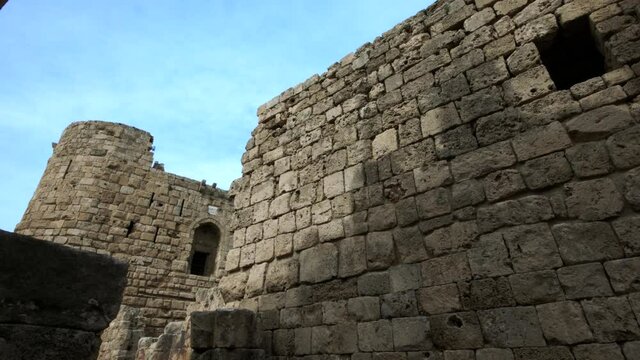Moving camera among walls of Sidon Sea Castle in Sidon, Lebanon