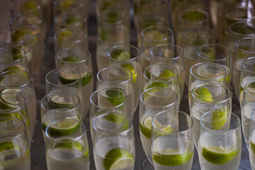 Refreshment cocktails with lime boats.