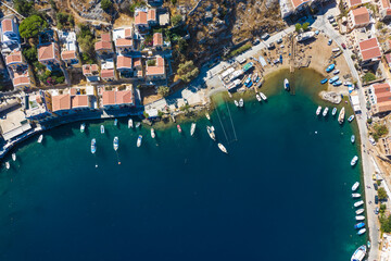 view from drone on the Bay of Simi island with ships at the pier. Greece Europe