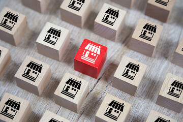 Wooden cube Stacked with Franchise business marketing icons Store for business growth concept.