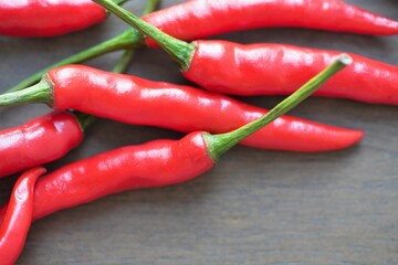 red chili peppers on wooden background