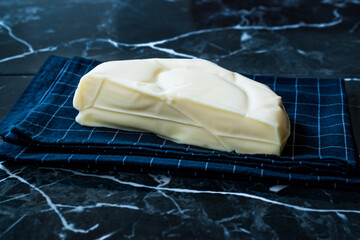 Turkish Cheese Abaza Peyniri on Black Tablecloth.