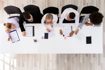 Business Taking Notes At The Meeting