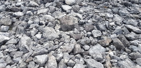 Group of gray stone or rock on ground for background or wallpaper - Hard material add Heavy object