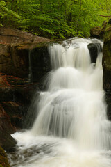 Fototapeta na wymiar Potoka Falls in super green forest surroundings, Czech Republic