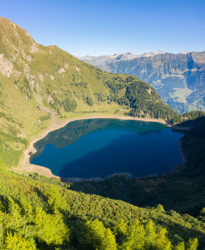 Aerial view at sunrise of the valley of Lago Tremorgio, from Alpe Campolungo with Valle Leventina and Pizzo del Sole below. Rodi, Prato Leventina, Valle Leventina, Canton Ticino, Switzerland.