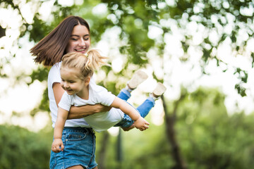 Time flies when you're having fun. Mother and daughter in in the park
