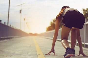 Female runners started preparing a run in the morning..concept for target to success.