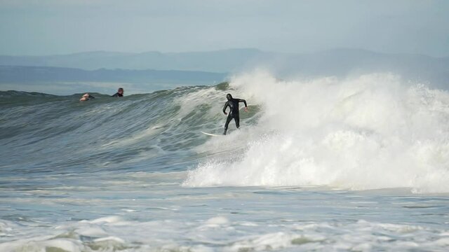 Surfer riding Supertubes surf in Jeffreys bay South Africa