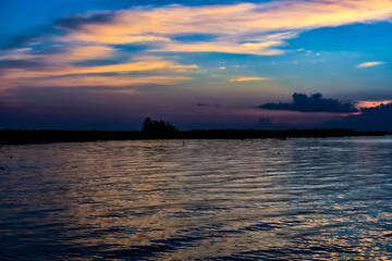 sunrise over lake with clouds