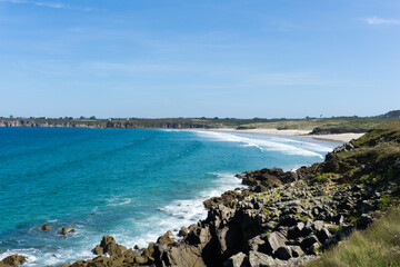 Fototapeta na wymiar Plage des Blancs Sablons beach on the west coast of Brittany landscape view with surfers