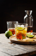 Strong golden rum with lime and ice