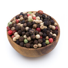 Pepper mix seed on spoon on white background.
